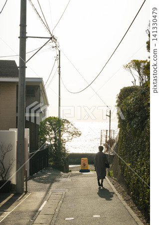 A quiet afternoon scene walking along a slope leading to the sea. A quiet afternoon scene walking along a slope leading to the sea. 141330479