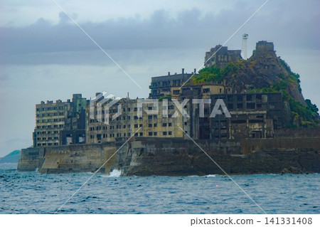 A view of Gunkanjima (Hashima Island): Former coal mine housing site and former coal mine site (rear side of Gunkanjima) A view of Gunkanjima (Hashima Island): Former coal mine housing site and former coal mine site (rear side of Gunkanjima) 141331408