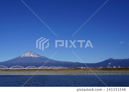 Mount Fuji, Mount Ashitaka, and the Fujikawa River stand out against the blue sky. January. Mount Fuji 2097. Mount Ashitaka and the Fujikawa Aqueduct Bridge. Mount Fuji, Mount Ashitaka, and the Fujikawa River stand out against the blue sky. January. Mount Fuji 2097. Mount Ashitaka and the Fujikawa Aqueduct Bridge. 141331546