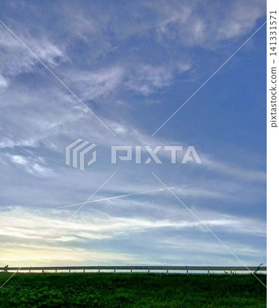 The sky stretching across the riverbank The sky stretching across the riverbank 141331571