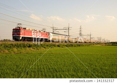Sleeper express train Cassiopeia running on the Tohoku Main Line at dusk Sleeper express train Cassiopeia running on the Tohoku Main Line at dusk 141332317