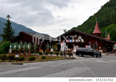 Nagano Prefecture, Matsumoto City: Roadside Station Kazana-no-Sato and mountain range Nagano Prefecture, Matsumoto City: Roadside Station Kazana-no-Sato and mountain range 141332502