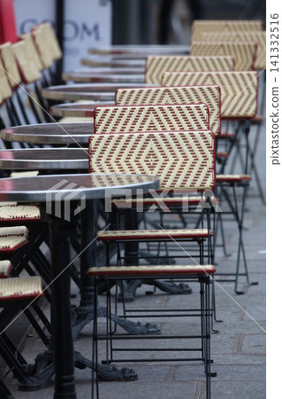 Chairs lined up in a cafe in Paris, France Chairs lined up in a cafe in Paris, France 141332516