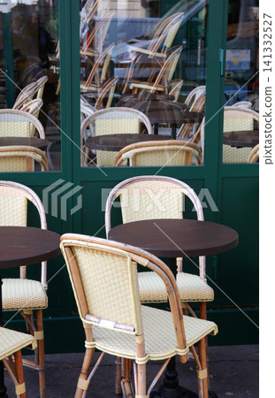 Chairs lined up in a cafe in Paris, France Chairs lined up in a cafe in Paris, France 141332527