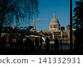 The Millennium Bridge leading towards the iconic dome of St. Paul's Cathedral in London 141332931