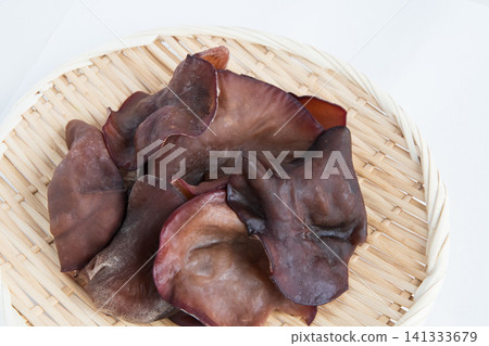 Raw wood ear mushrooms served in a colander Raw wood ear mushrooms served in a colander 141333679