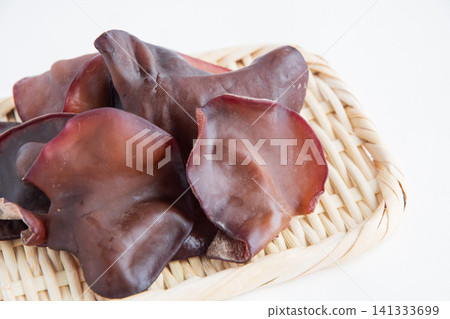Raw wood ear mushrooms served in a colander Raw wood ear mushrooms served in a colander 141333699