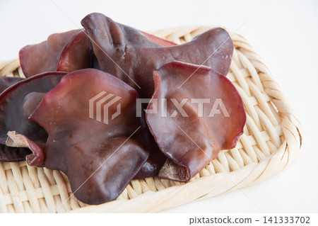 Raw wood ear mushrooms served in a colander Raw wood ear mushrooms served in a colander 141333702