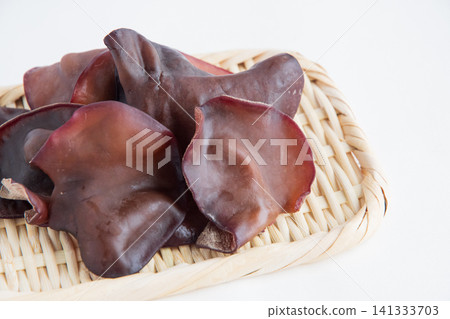 Raw wood ear mushrooms served in a colander Raw wood ear mushrooms served in a colander 141333703