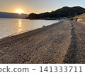 A quiet beach bathed in the morning sun 141333711