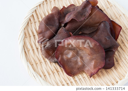 Raw wood ear mushrooms served in a colander Raw wood ear mushrooms served in a colander 141333714