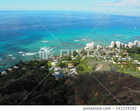 A breathtaking view of Waikiki and the beautiful Pacific Ocean from the summit of Diamond Head. A breathtaking view of Waikiki and the beautiful Pacific Ocean from the summit of Diamond Head. 141334102