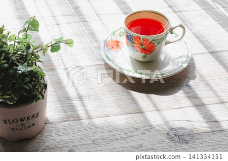Morning tea by the window, bathed in sunlight. Morning tea by the window, bathed in sunlight. 141334151
