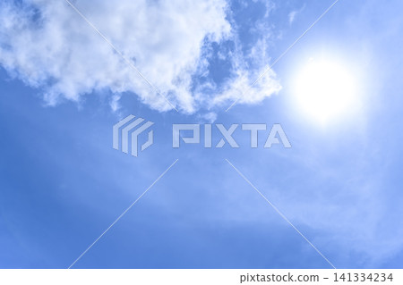 The sun and white clouds shining in the summer sky of Yokohama The sun and white clouds shining in the summer sky of Yokohama 141334234