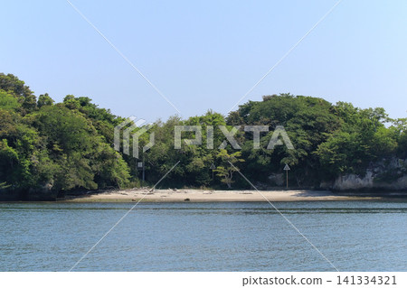 A sandy beach on the south side of Nonoshima Island in the Urado Islands. A sandy beach on the south side of Nonoshima Island in the Urado Islands. 141334321
