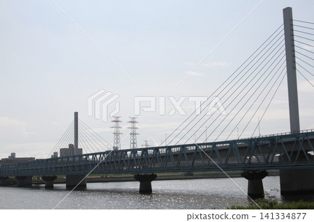 The Tozai Line's Arakawa-Nakagawa Bridge and Kiyosuna Bridge, which span the Arakawa River. The Tozai Line's Arakawa-Nakagawa Bridge and Kiyosuna Bridge, which span the Arakawa River. 141334877