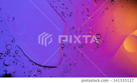 Vibrant purple, pink, and orange oil drops creating an abstract liquid background Vibrant purple, pink, and orange oil drops creating an abstract liquid background 141335117