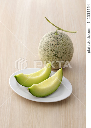 Fresh melon served on a white plate Fresh melon served on a white plate 141335564