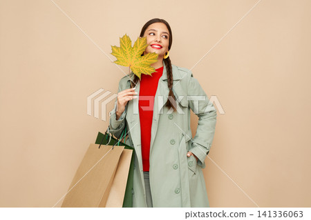 Autumn portrait of beautiful young woman 141336063