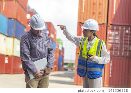 Female manager scolding and mad at foreman worker at container ship yard. Mistake and error in import-export business. Female manager scolding and mad at foreman worker at container ship yard. Mistake and error in import-export business. 141336318