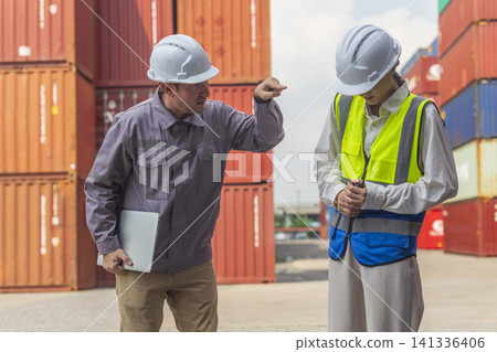 Female manager scolding and mad at foreman worker at container ship yard. Mistake and error in import-export business. Female manager scolding and mad at foreman worker at container ship yard. Mistake and error in import-export business. 141336406