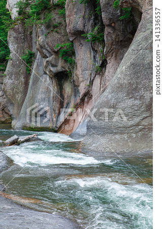 The natural scenery of Fukiware Gorge and Fukiware Falls, enveloped in the fresh greenery of summer, in Numata City, Gunma Prefecture. The natural scenery of Fukiware Gorge and Fukiware Falls, enveloped in the fresh greenery of summer, in Numata City, Gunma Prefecture. 141336557