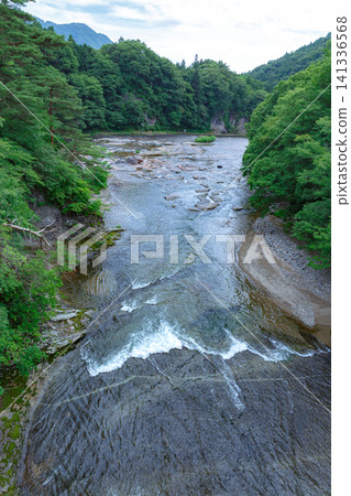 The natural scenery of Fukiware Gorge and Fukiware Falls, enveloped in the fresh greenery of summer, in Numata City, Gunma Prefecture. The natural scenery of Fukiware Gorge and Fukiware Falls, enveloped in the fresh greenery of summer, in Numata City, Gunma Prefecture. 141336568