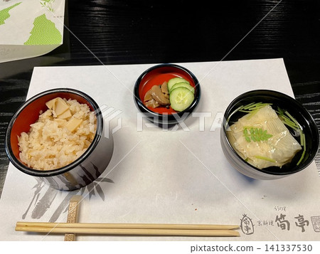 An elegant kaiseki meal featuring bamboo shoot rice and soup. An elegant kaiseki meal featuring bamboo shoot rice and soup. 141337530