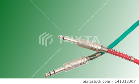 Electric cables with jacks on green gradient.Connection sound equipment Electric cables with jacks on green gradient.Connection sound equipment 141338307