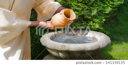 Hands pour water into the pot Hands pour water into the pot 141339135