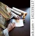 Male hand witn big quill 141339137