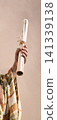 Male hand holding an old scroll 141339138