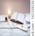 Bible on white wooden table 141339150