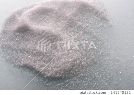 A close-up texture representation of table salt, showing layers of white, granular salt. A close-up texture representation of table salt, showing layers of white, granular salt. 141340121