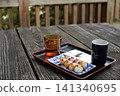 Mitarashi dango enjoyed at a Japanese-style cafe 141340695