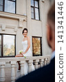 Happy and in love bride and groom on the balcony at the railing at the entrance  141341446