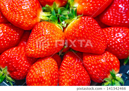 Fresh ripe organic strawberry in a dark plate Fresh ripe organic strawberry in a dark plate 141342466