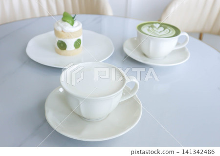 hot milk and green tea or matcha green tea, milk green tea or matcha latte or matcha green tea latte and cake hot milk and green tea or matcha green tea, milk green tea or matcha latte or matcha green tea latte and cake 141342486