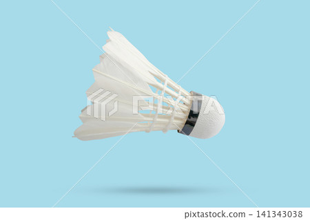 Badminton shuttlecock floating on blue background Badminton shuttlecock floating on blue background 141343038