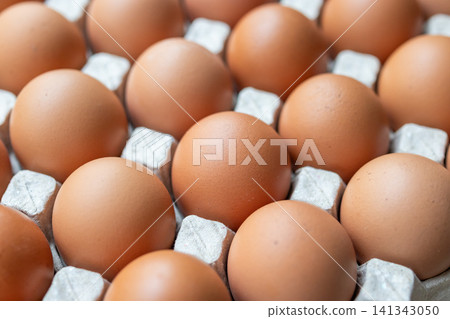 Fresh organic brown chicken eggs in cardboard tray Fresh organic brown chicken eggs in cardboard tray 141343050