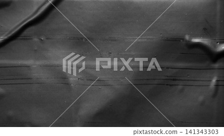 transparent plastic bag wrap overlay texture on black background transparent plastic bag wrap overlay texture on black background 141343303