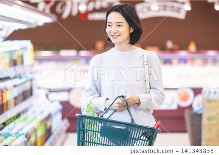Female shoppers shopping at the supermarket Female shoppers shopping at the supermarket 141343833