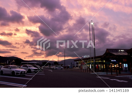 Nagano Prefecture: Commercial facilities and sunset sky at the Suwako Service Area (outbound lane) on the Chuo Expressway. 141345189