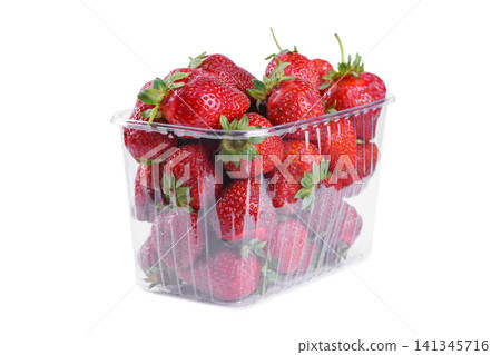 Fresh red strawberry in plastic punnet or transparent box, container isolated on white background Fresh red strawberry in plastic punnet or transparent box, container isolated on white background 141345716
