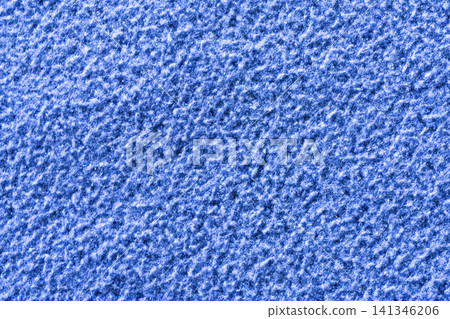 A textured blue surface fills the frame. A textured blue surface fills the frame. 141346206