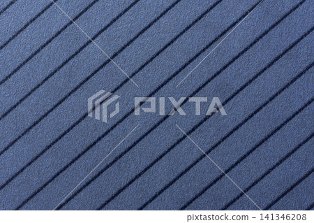 Background of a blue, textured surface featuring parallel, dark blue diagonal stripes. Background of a blue, textured surface featuring parallel, dark blue diagonal stripes. 141346208
