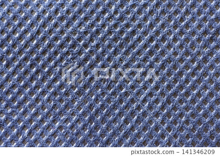 a blue textured material with a repeating diamond pattern. a blue textured material with a repeating diamond pattern. 141346209