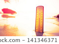 Thermometer on sunset sea beach in tropical abnormal heat. Extremely hot day. 141346371
