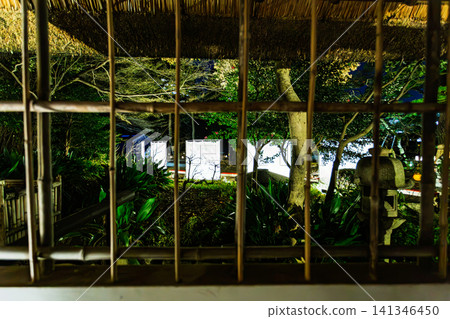 A view of the illuminated Koishikawa Korakuen Garden and the Tokugawa family's encampment tents, seen through the latticework of the Kyuhachiya inn. January 2024. 141346450