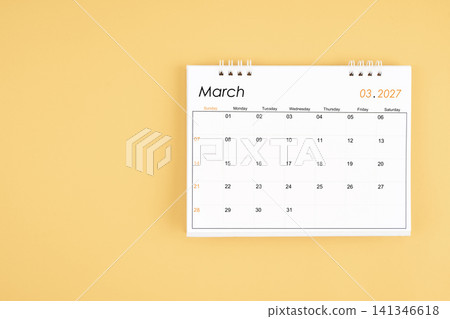 March 2027 desk calendar on yellow color background, position with copy space. March 2027 desk calendar on yellow color background, position with copy space. 141346618